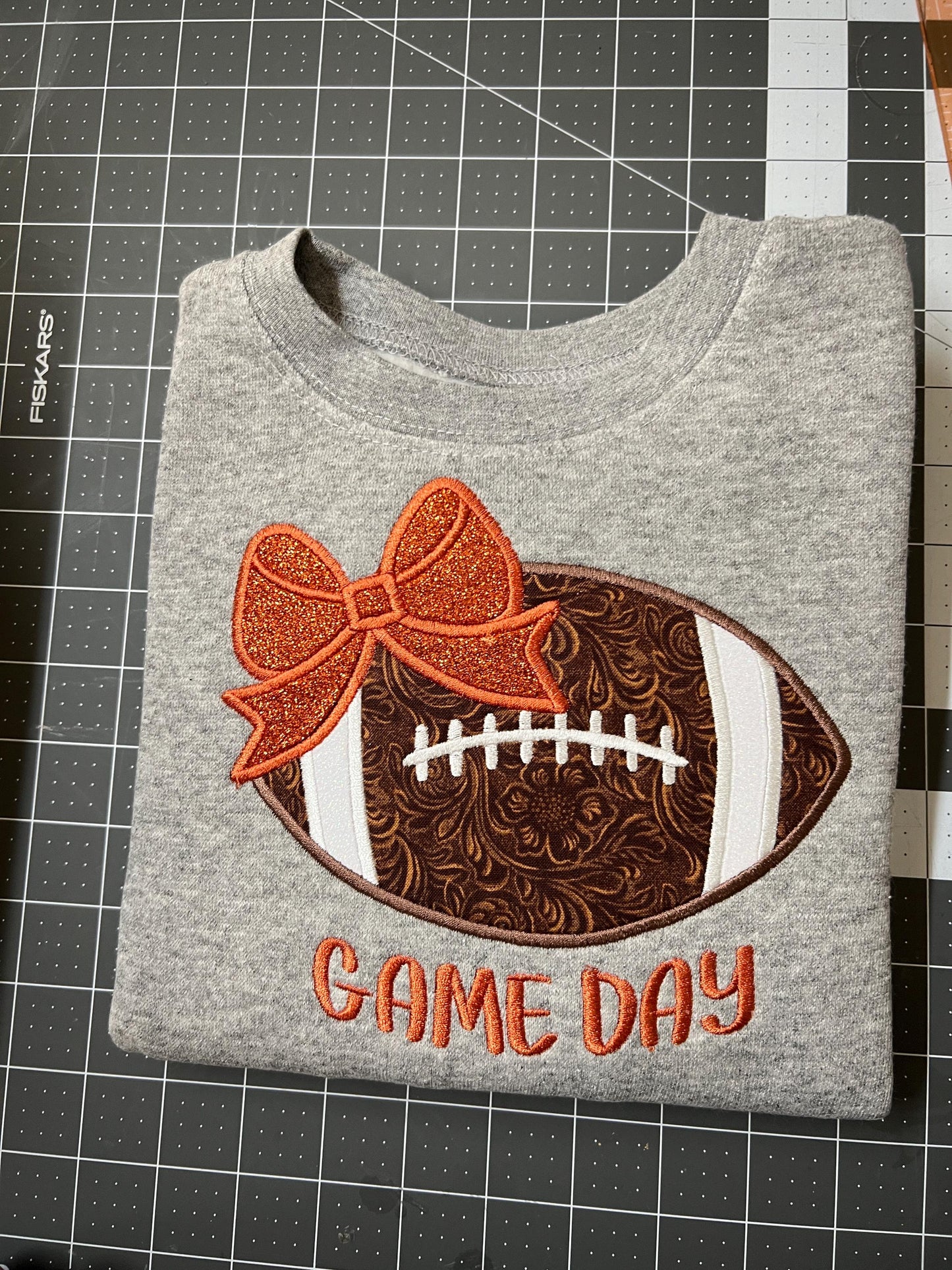 Girls Game Day Football with a Bow Embroidered Sweatshirt - personalization available.
