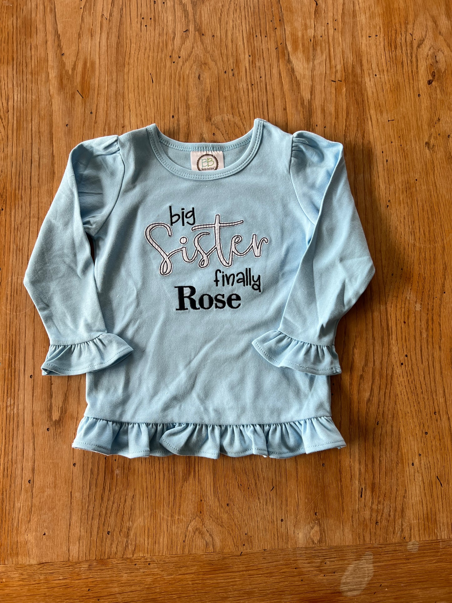 Big Sister Finally Embroidered long sleeve ruffle tee