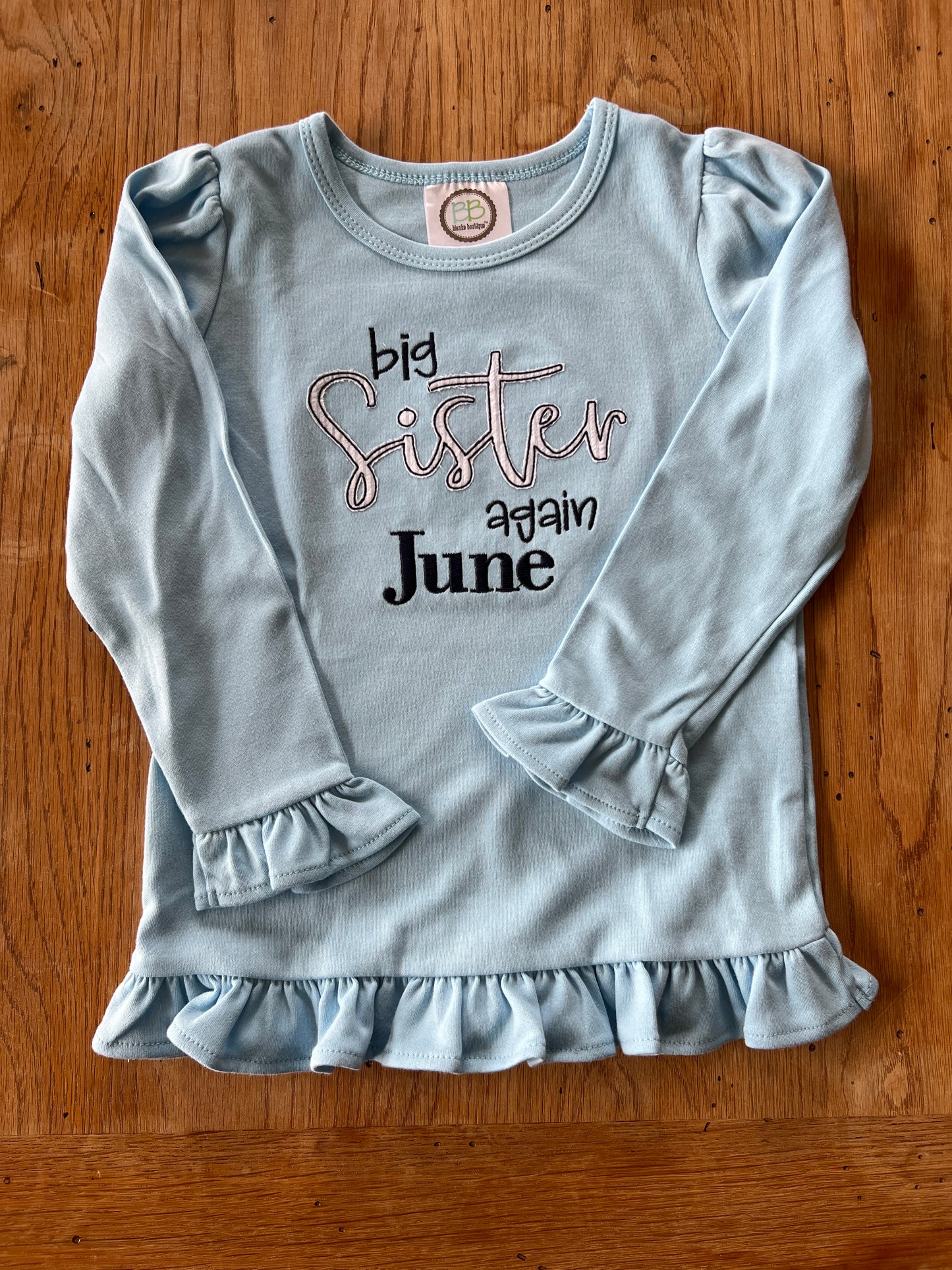 Big Sister Again embroidered long sleeve ruffle tee