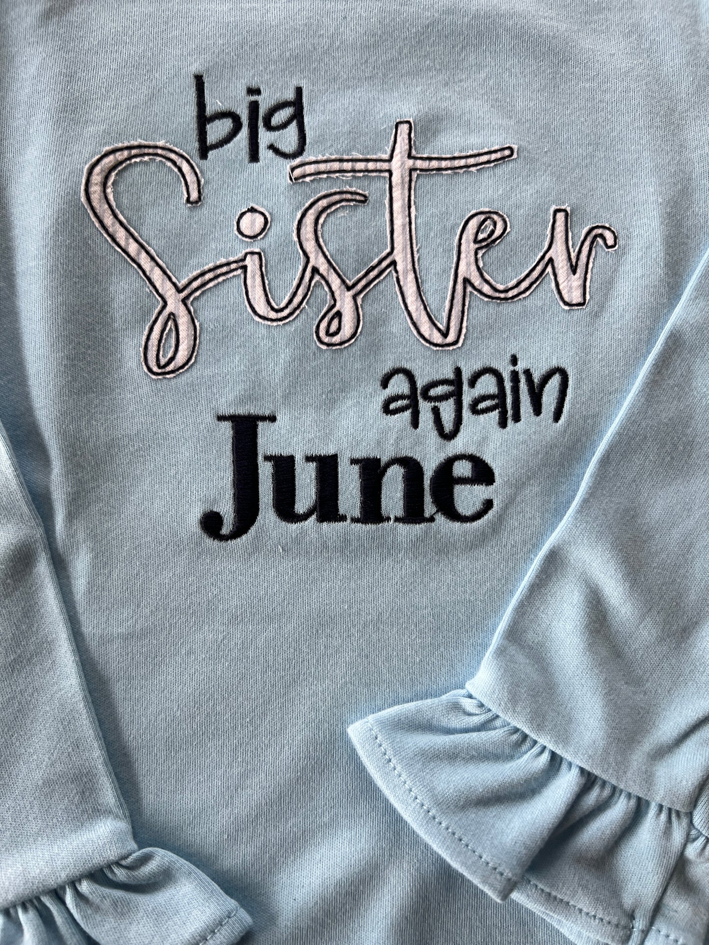 Big Sister Again embroidered long sleeve ruffle tee