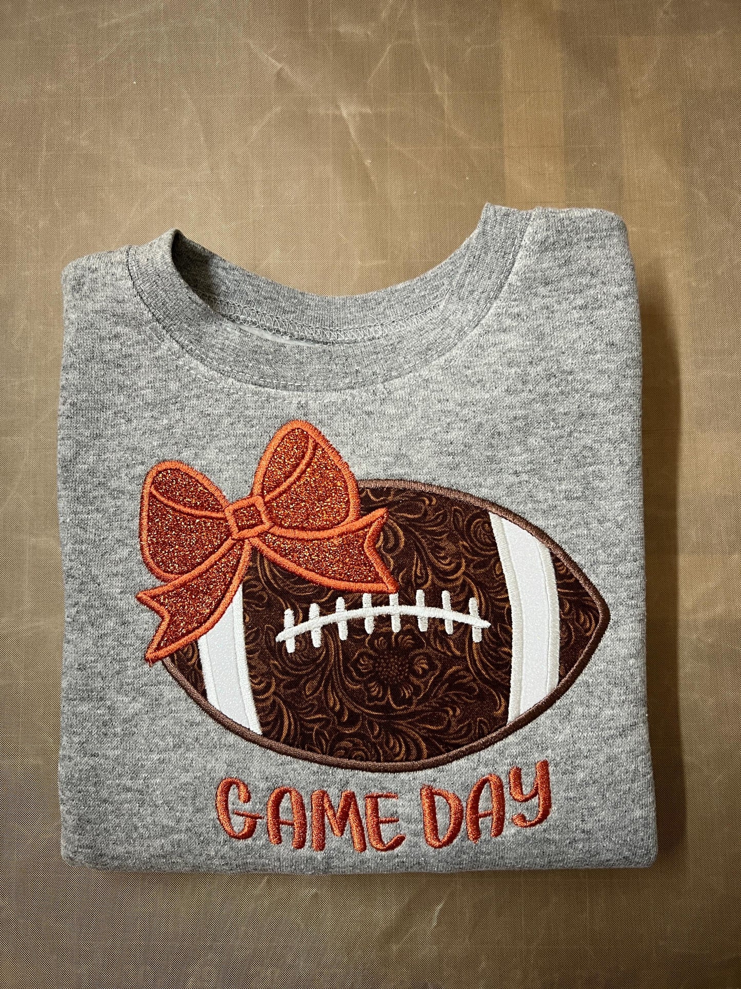 Girls Game Day Football with a Bow Embroidered Sweatshirt - personalization available.