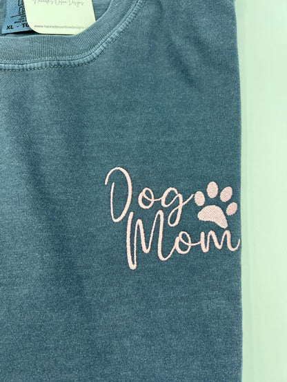 Nannette's Online Designs blue-grey garment-dyed cotton t-shirt with soft pink embroidered Dog Mom and paw print text.