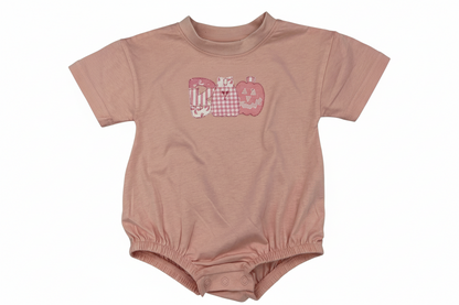 Nannette's Online Designs pastel pink infant bubble romper featuring a BOO applique with gingham and striped patterns.