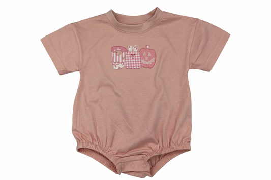 Nannette's Online Designs pastel pink infant bubble romper featuring a BOO applique with gingham and striped patterns.