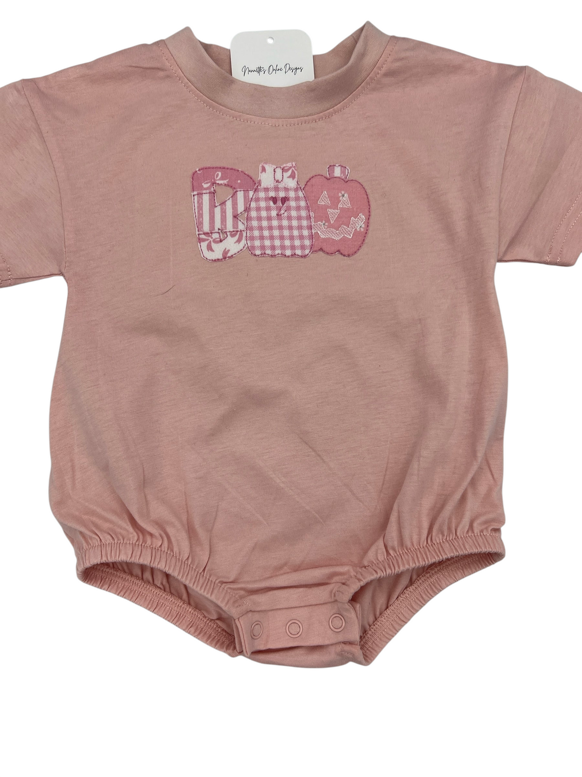 Nannette's Online Designs pastel pink infant bubble romper featuring a BOO applique with gingham and striped patterns.