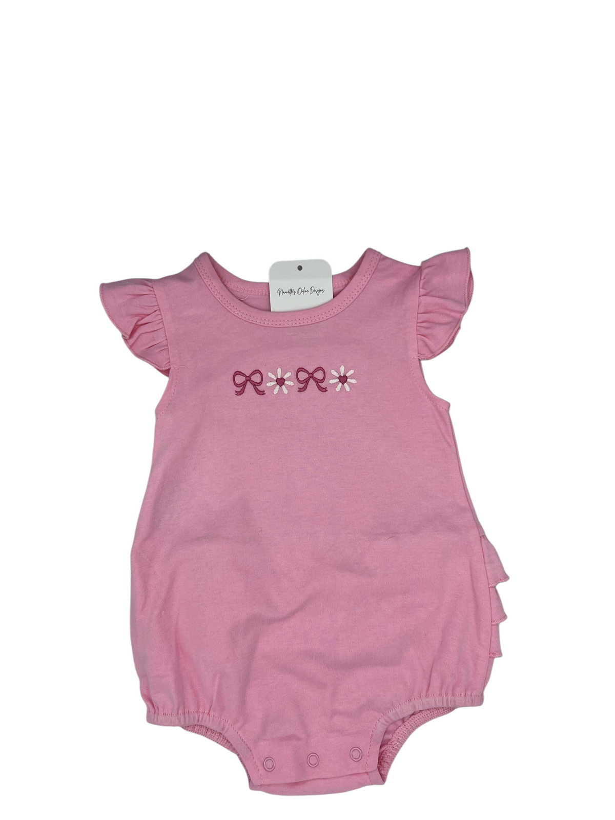 Nannette's Online Designs pink infant bubble romper with ruffle sleeves and embroidered bow and flower detail