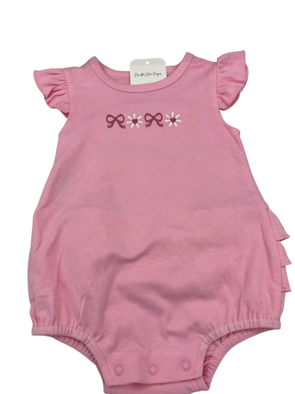 Nannette's Online Designs pink infant bubble romper with ruffle sleeves, bow and flower embroidery, and bottom snaps.