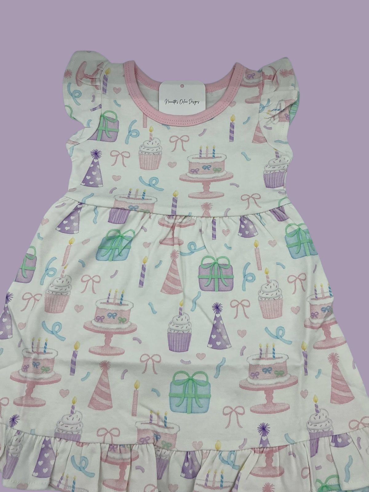 Nannette's Online Designs toddler birthday dress with pastel cake, cupcake, and gift print, flutter sleeves and ruffles