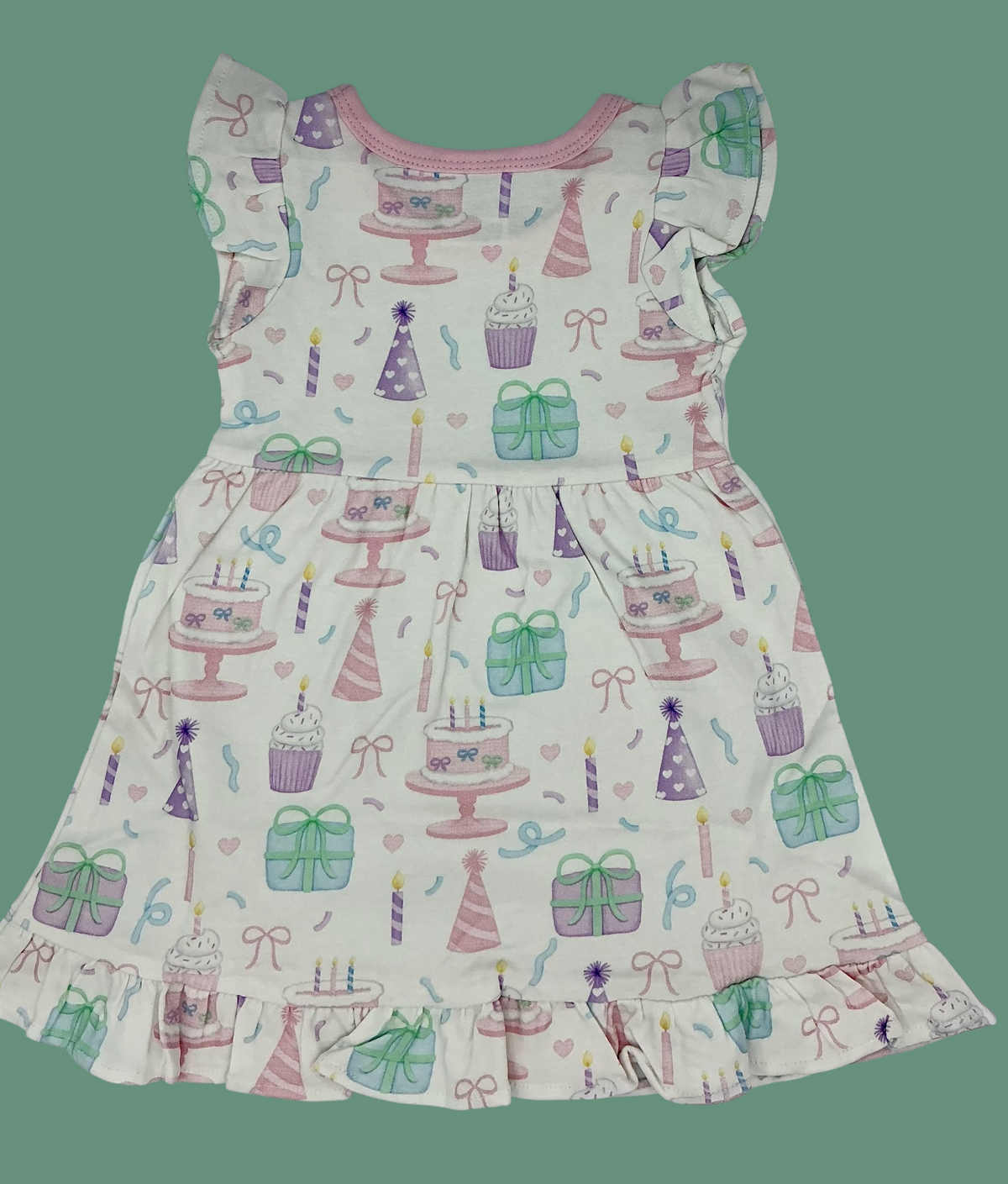 Nannette's Online Designs toddler girl birthday dress with pastel cake, cupcake, and gift print and ruffled hem.