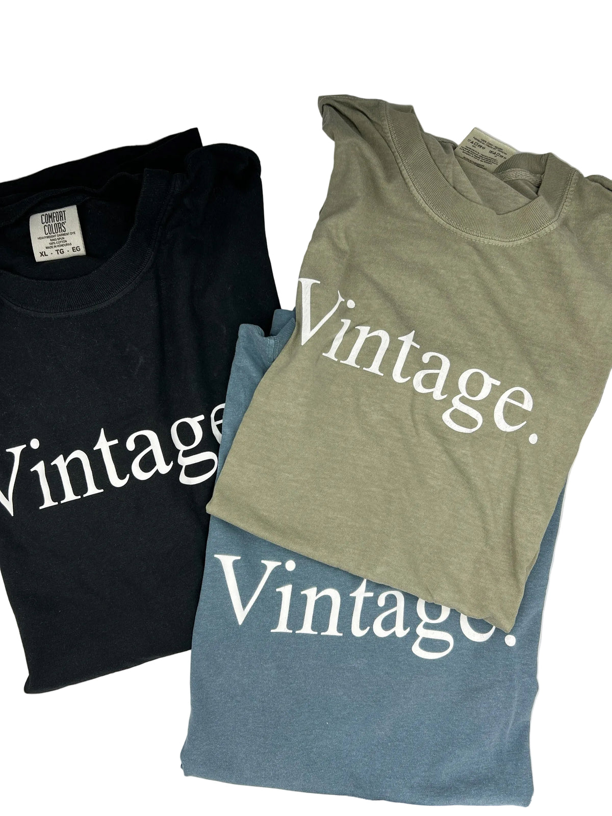 Nannette's Online Designs vintage graphic crewneck t-shirts in black, olive green, and blue heavyweight cotton.